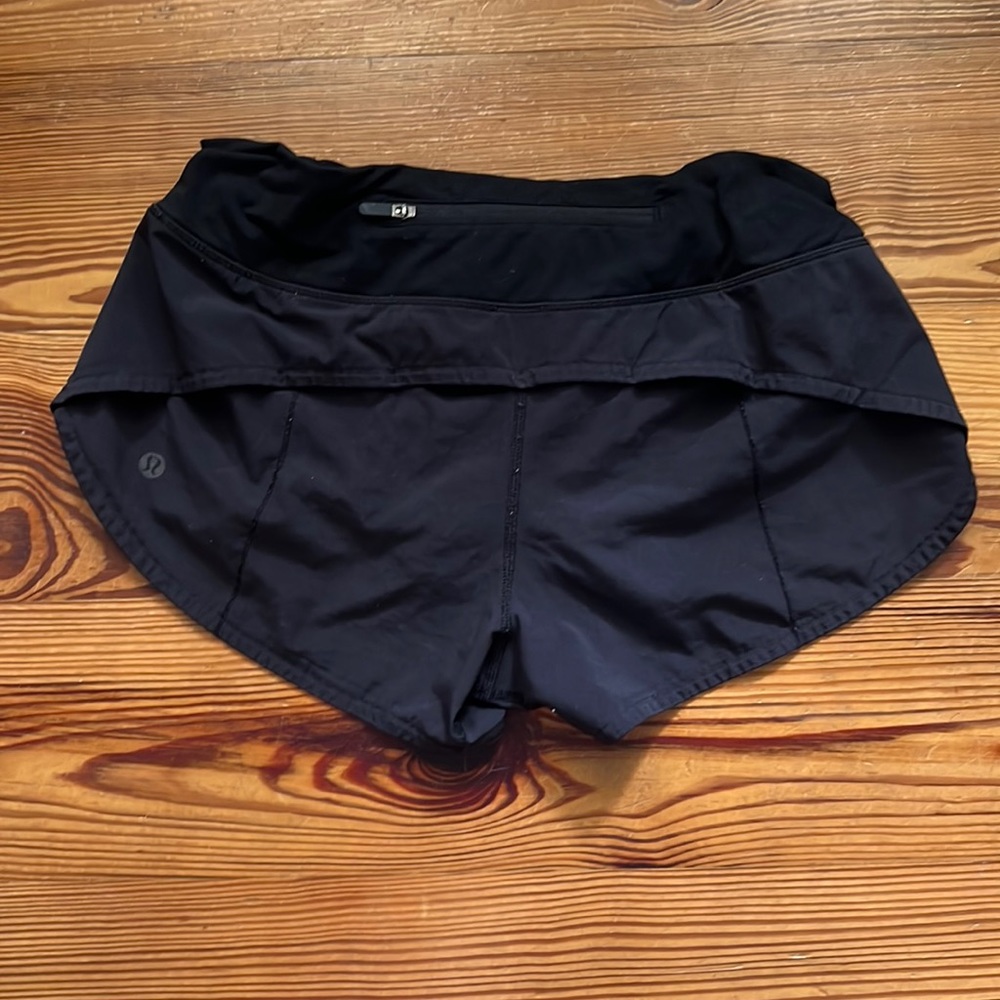 Speed up low rise lined shorts 2.5 inches with zipper on the back.